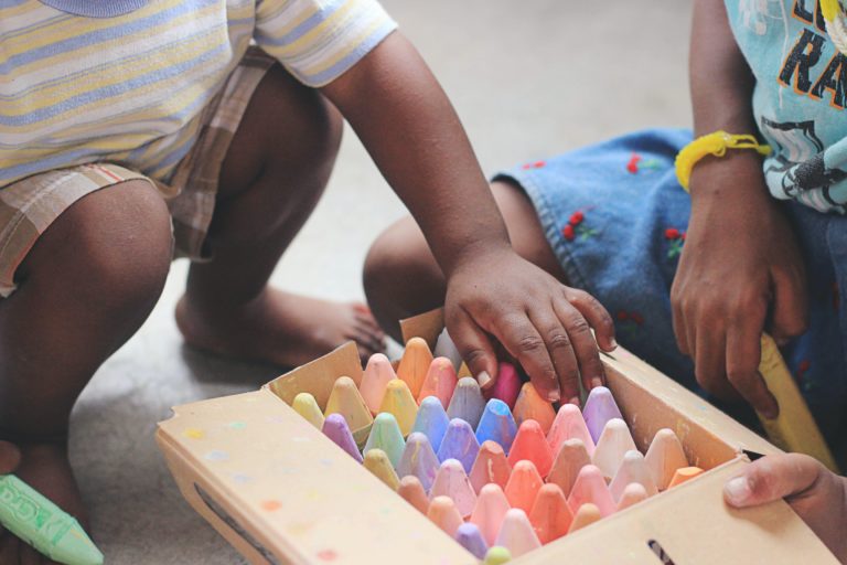 child hand crayons ele charity